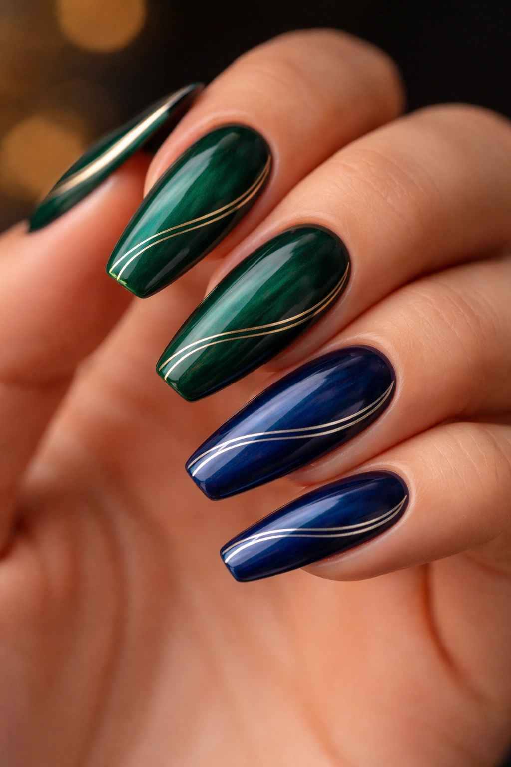 Deep emerald or sapphire curved coffin nails with subtle gold lines