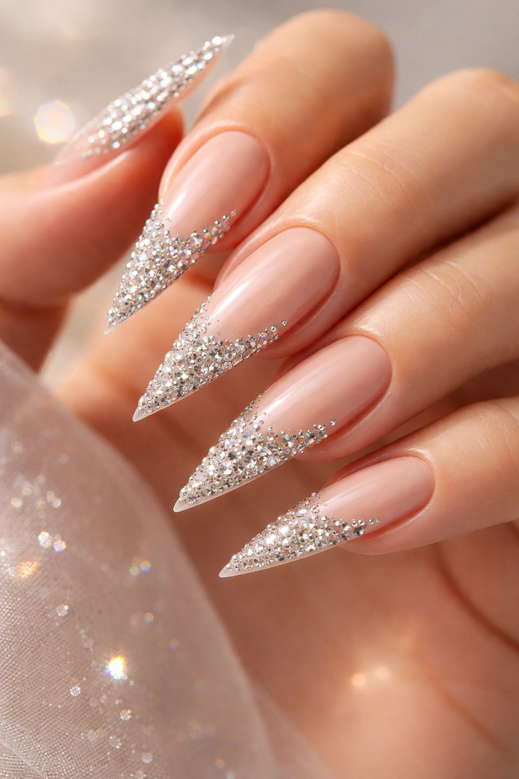 Close-up of stiletto nails with crystal-encrusted tips