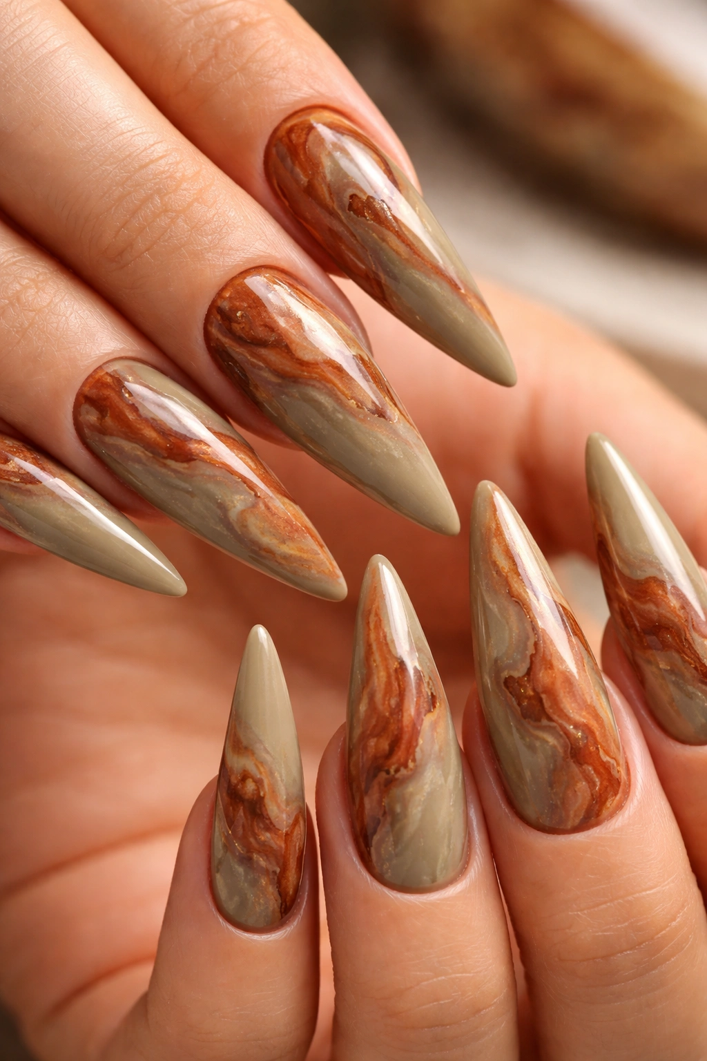 Khaki and terracotta marble stiletto nails