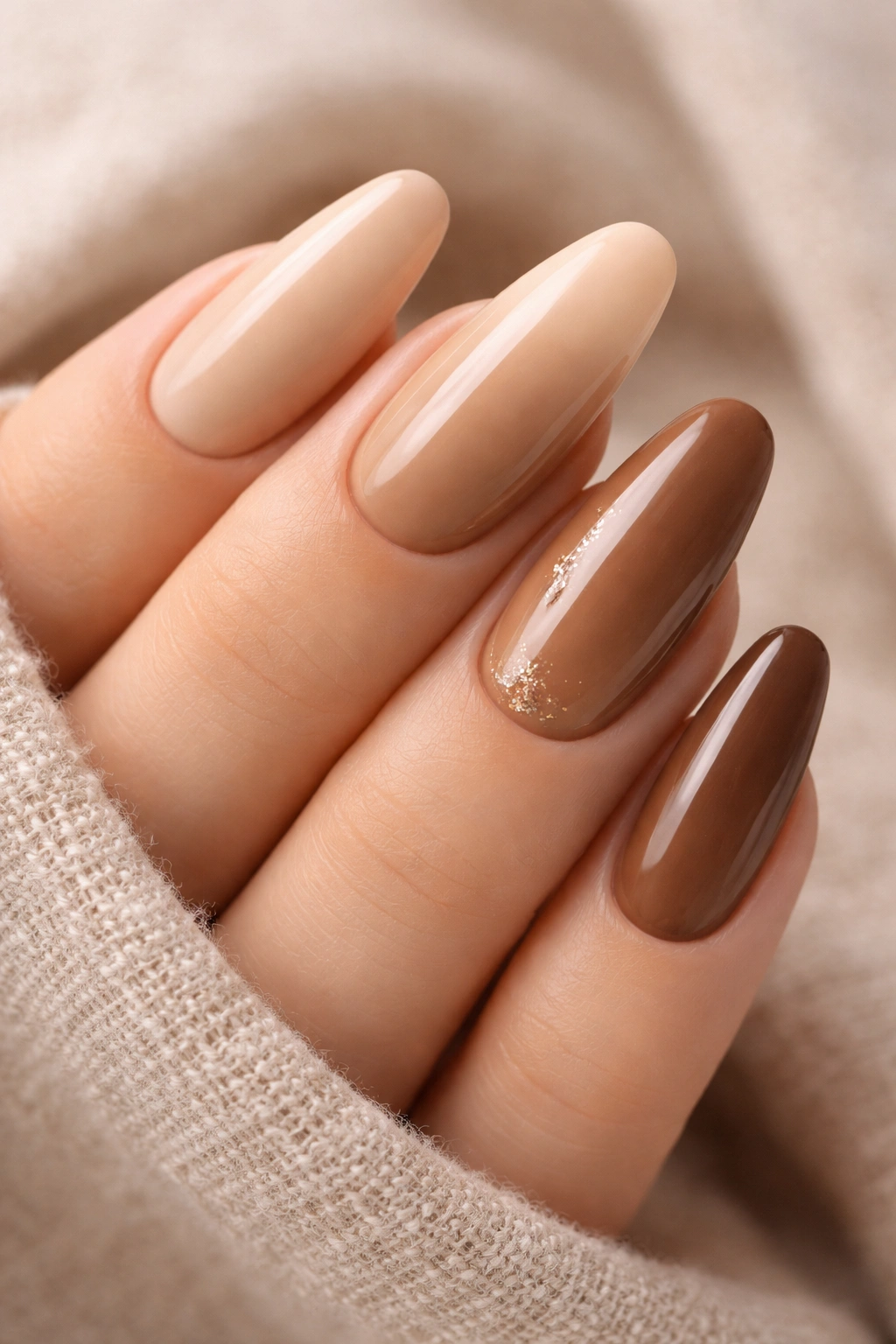 Close-up of neutral latte nails in creamy cappuccino to mocha shades