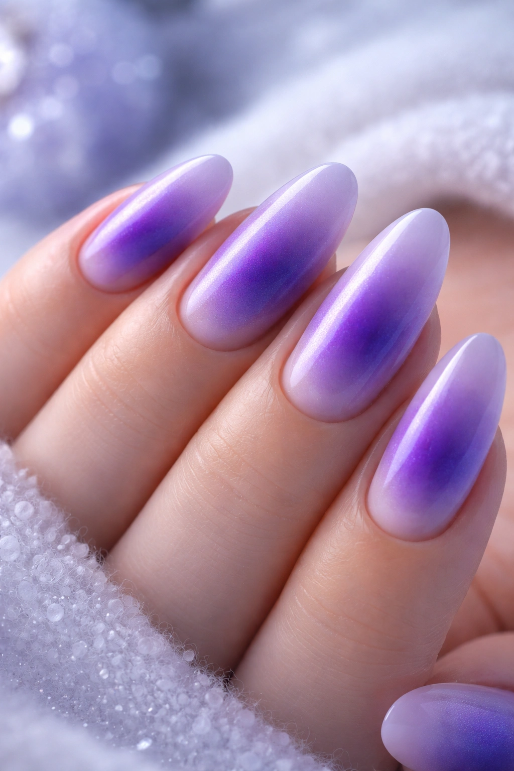 Close-up of lavender aura nails with pale edges and purple center