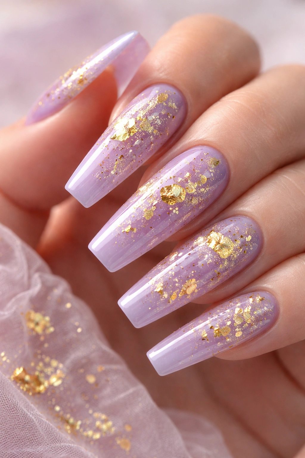 Lavender nails with encapsulated gold leaf flakes on coffin nails