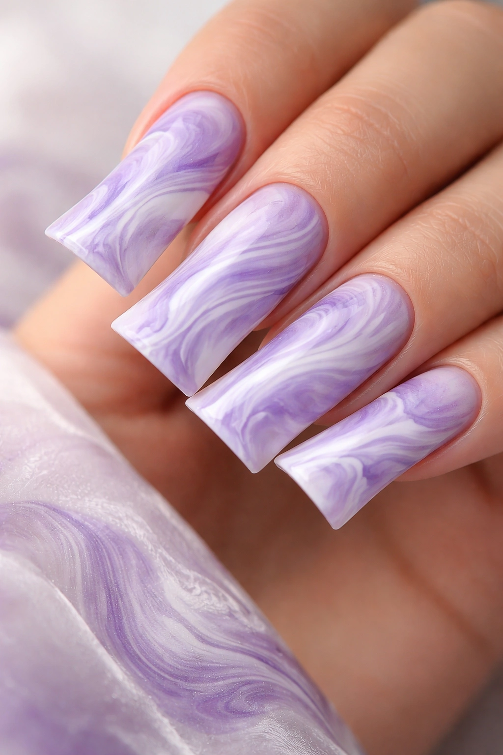 Lavender marble nails with white and purple swirls