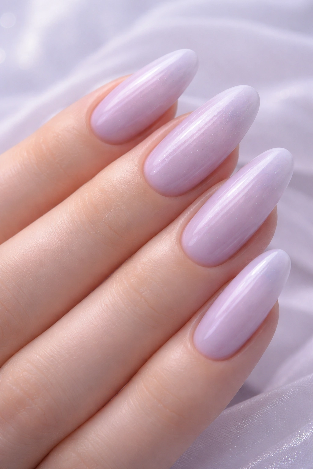 Close-up of soft lavender milk bath nails on long oval nails
