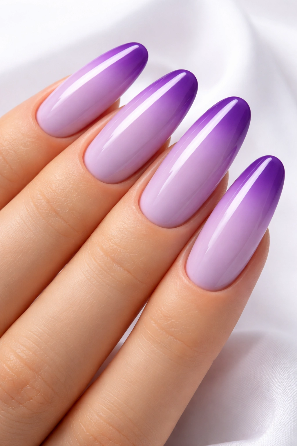 Close-up of lavender nail with purple ombré tips