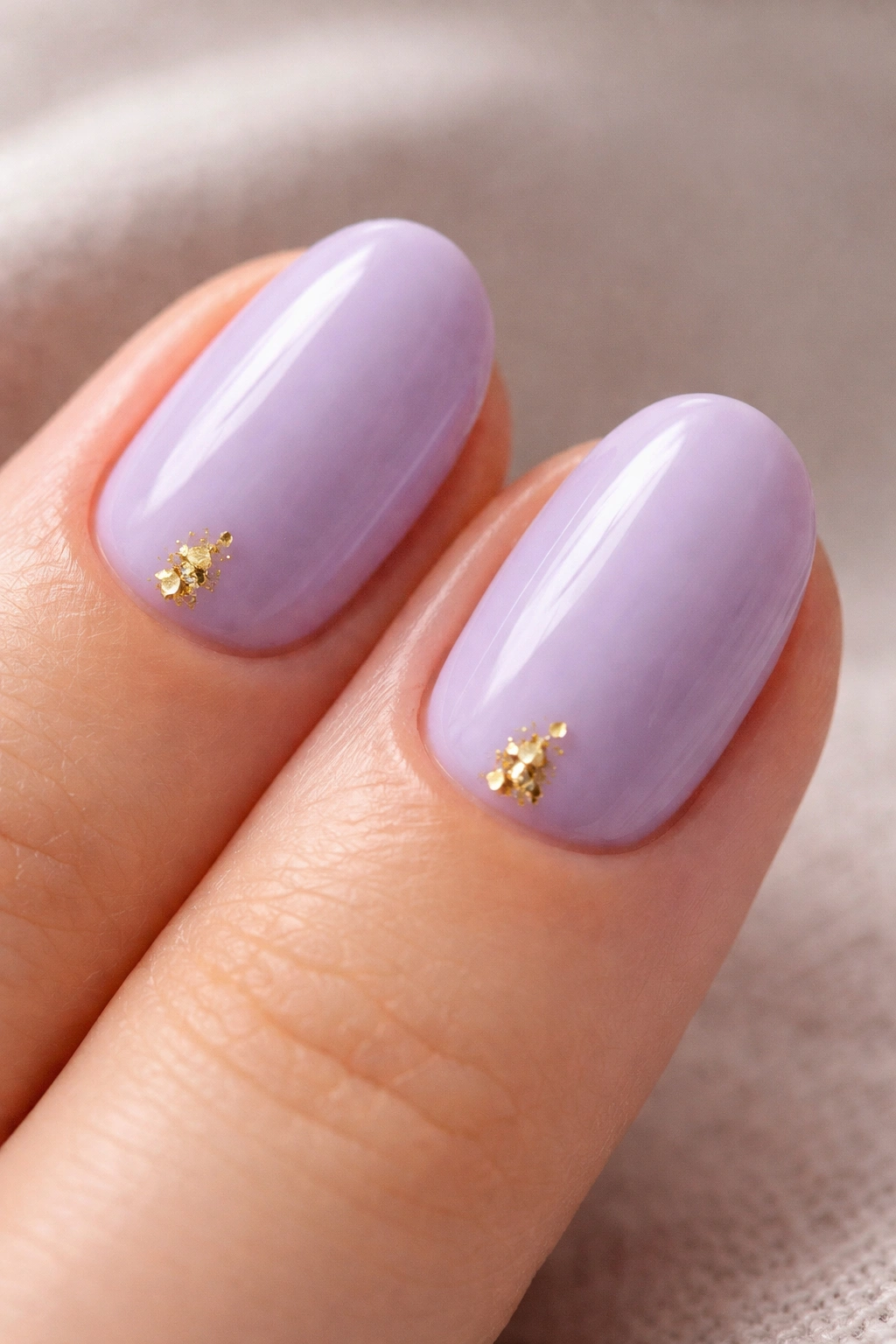 Lavender nails with tiny gold foil accents on small area