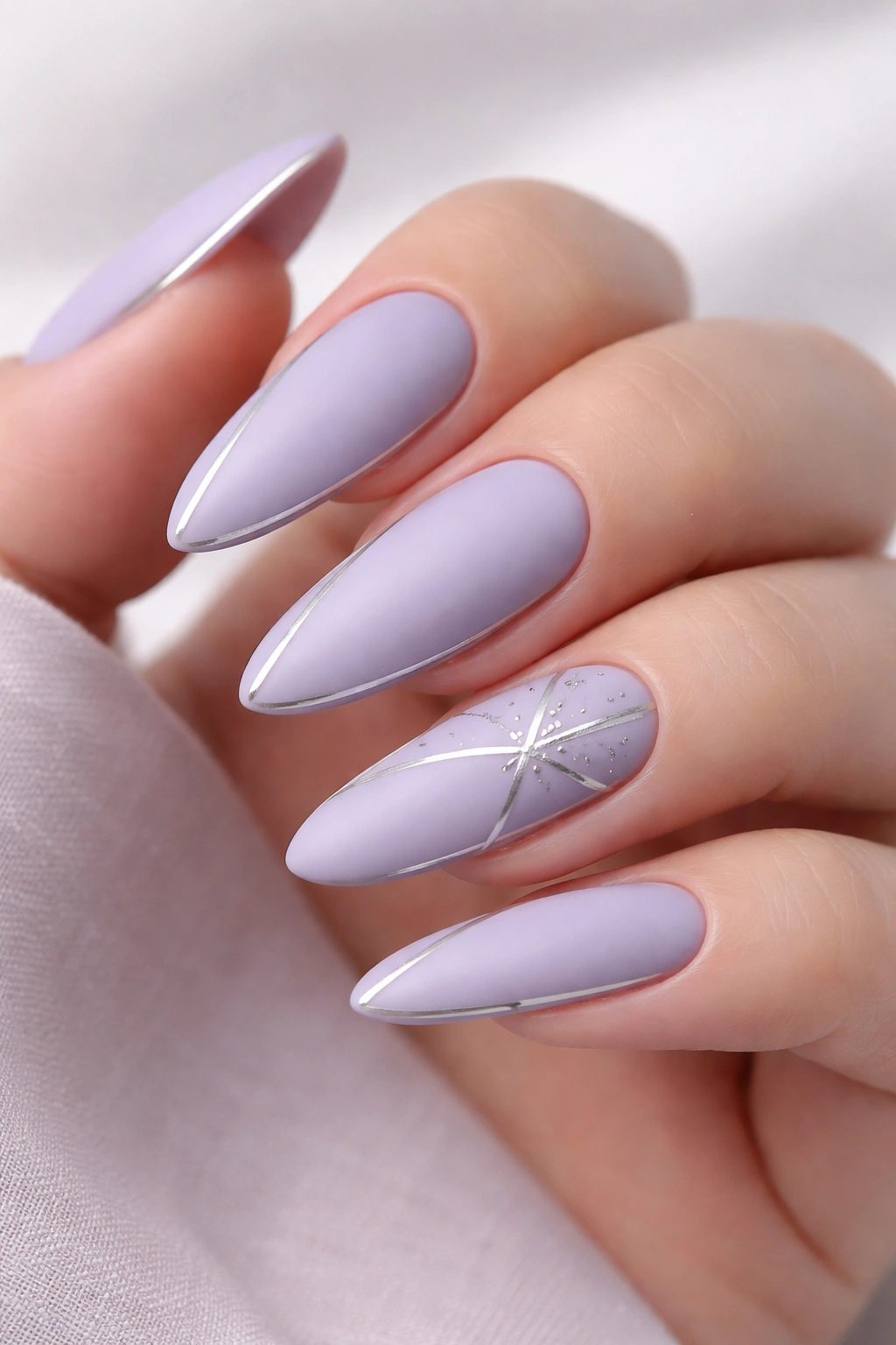 Lavender matte nails with silver geometric accents