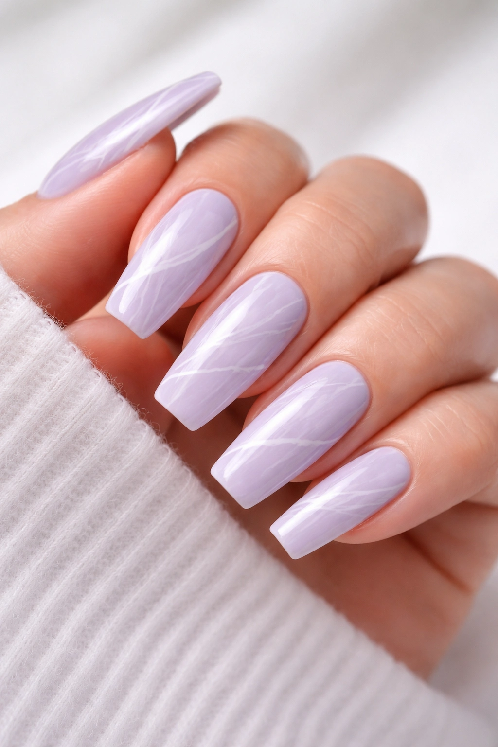 Coffin nails with lavender base and white marble vein patterns