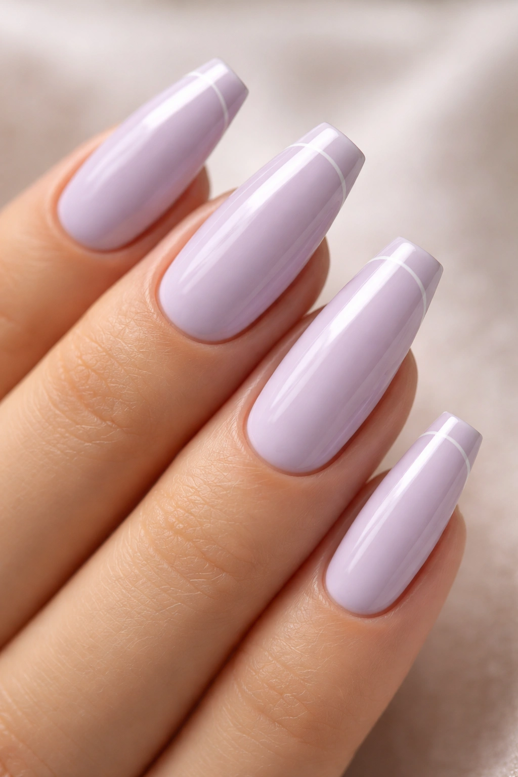 Lavender nails with micro French tips on a pastel ballerina shape.