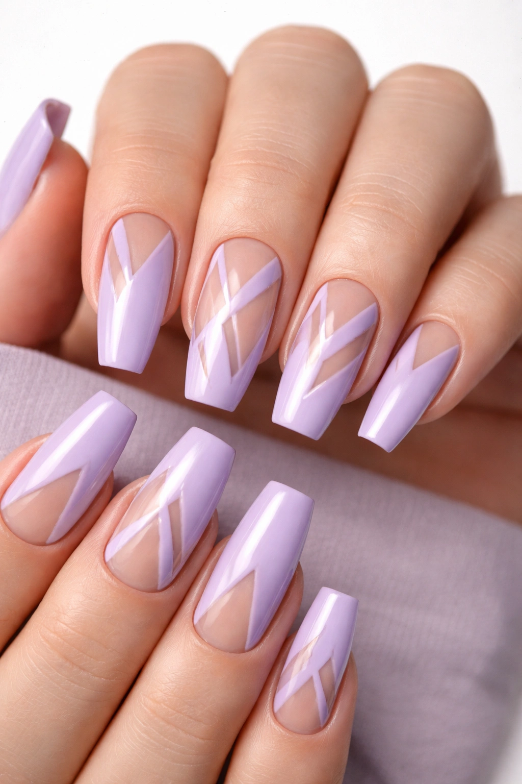Coffin nails showing lavender base with geometric negative space patterns