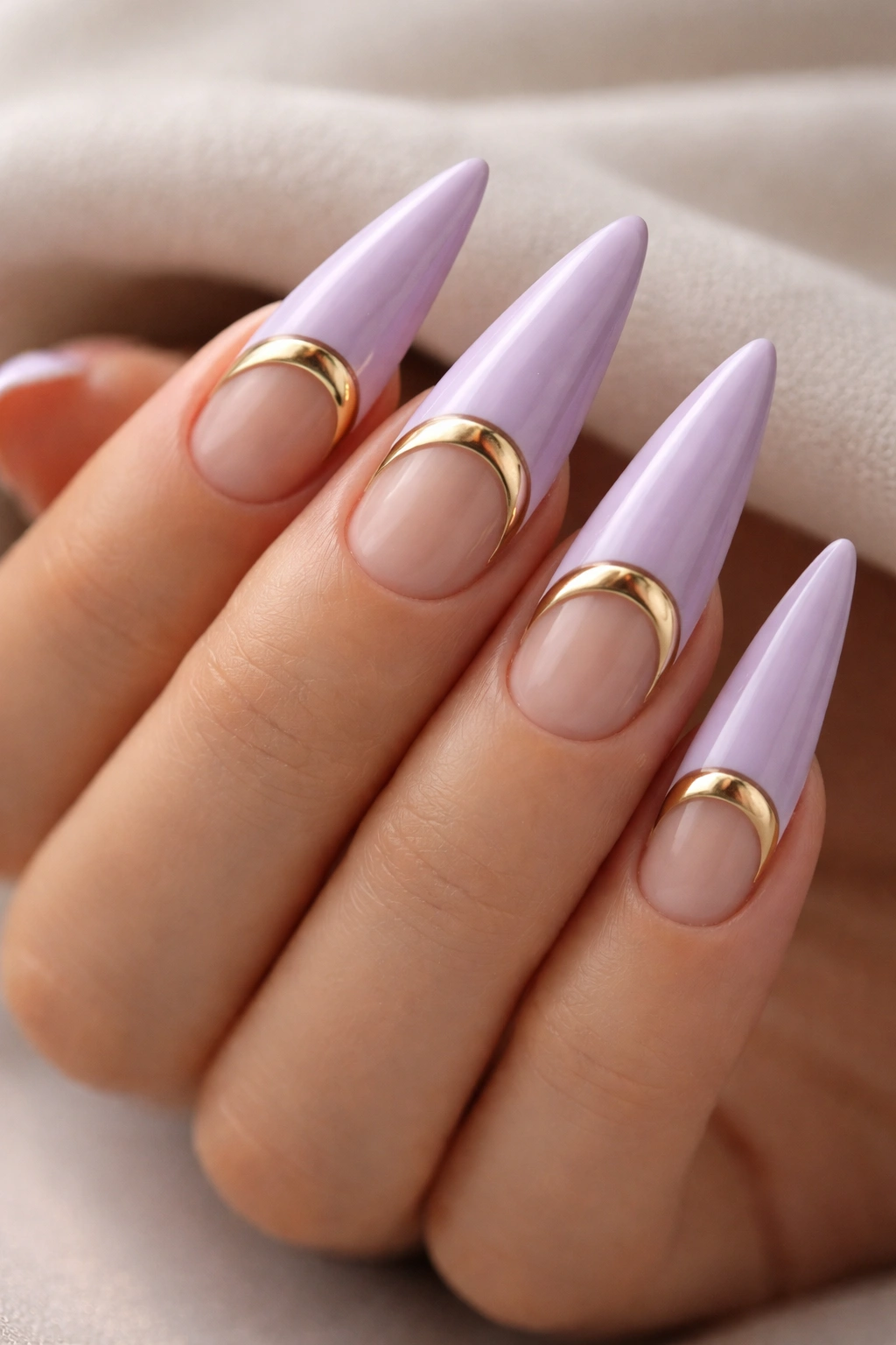 Lavender nails with a negative-space moon design in metallic gold
