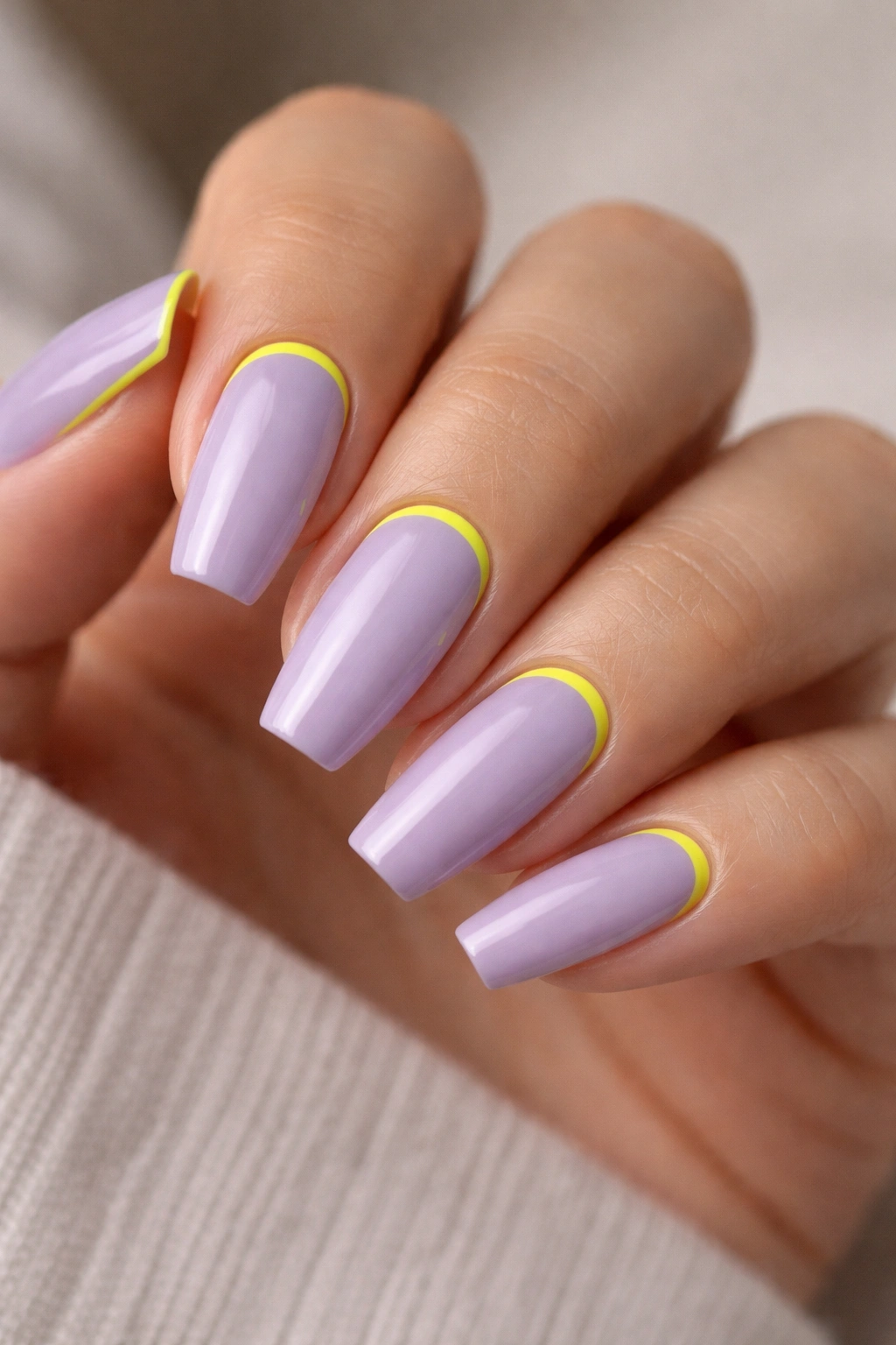 Lavender nails with neon yellow cuticle line on ballerina shape