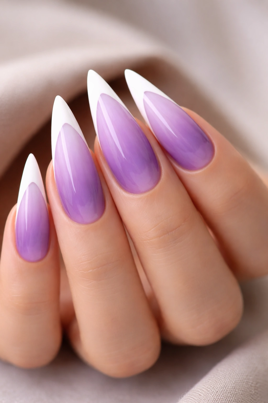 Lavender nails with purple ombré and white tips showing depth and contrast