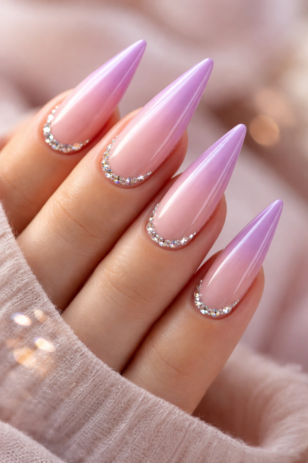 Lavender-rose ombré stiletto nails with tiny diamond accents