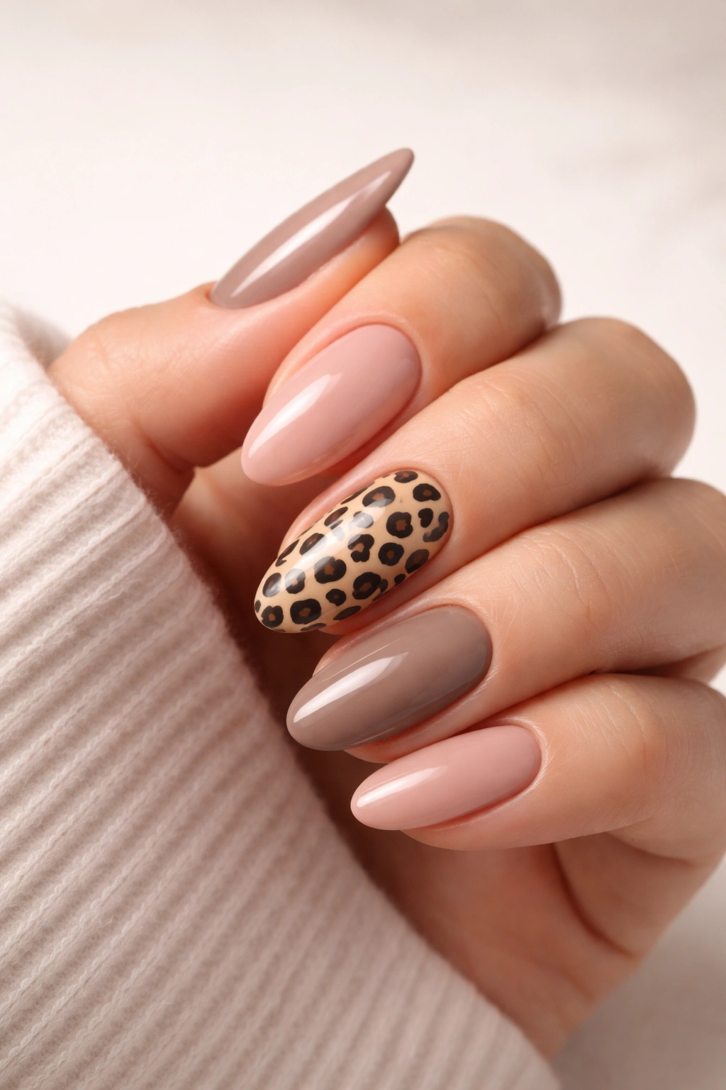 One leopard print accent nail among solid nails