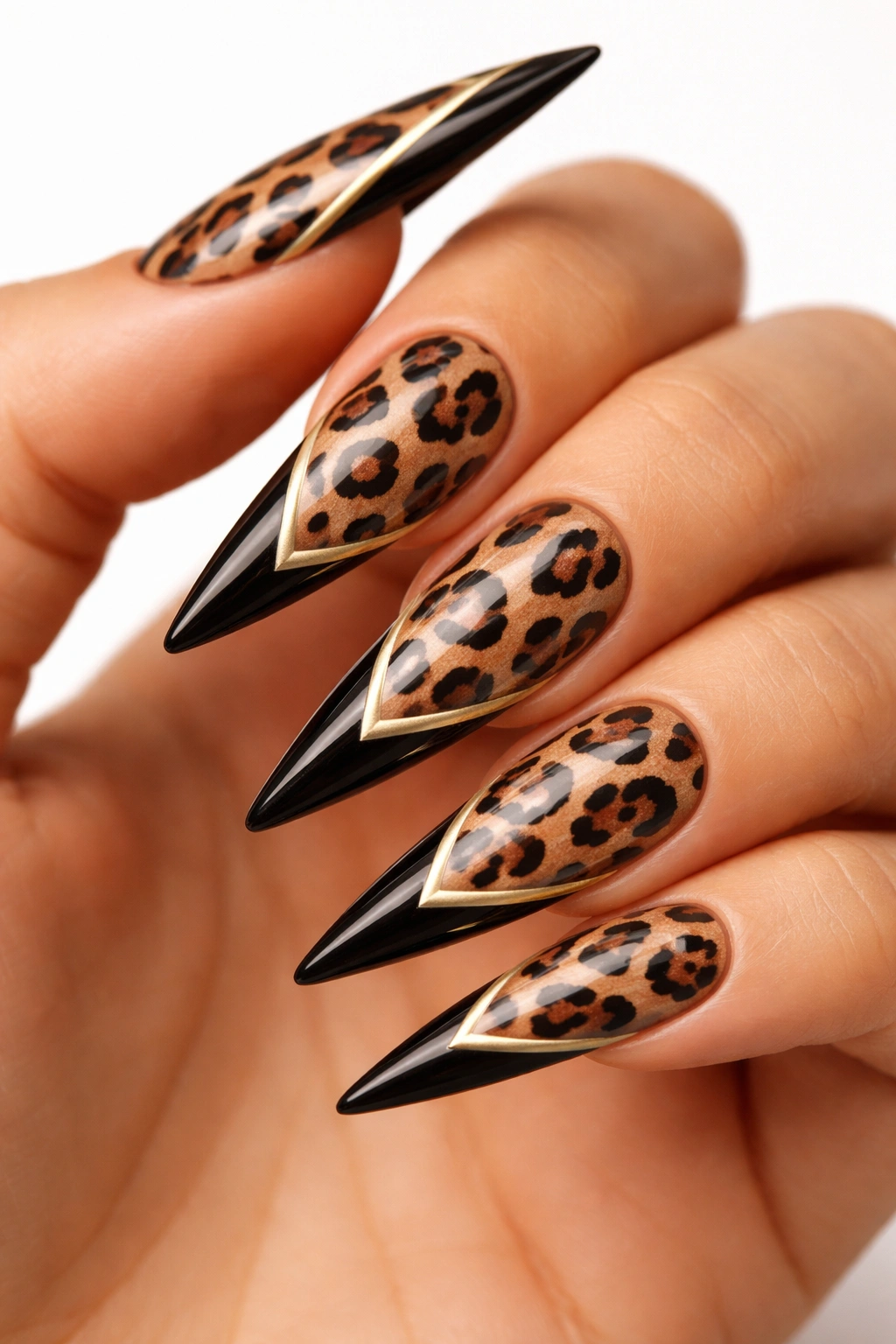 Leopard-print stiletto nails with geometric gold tip