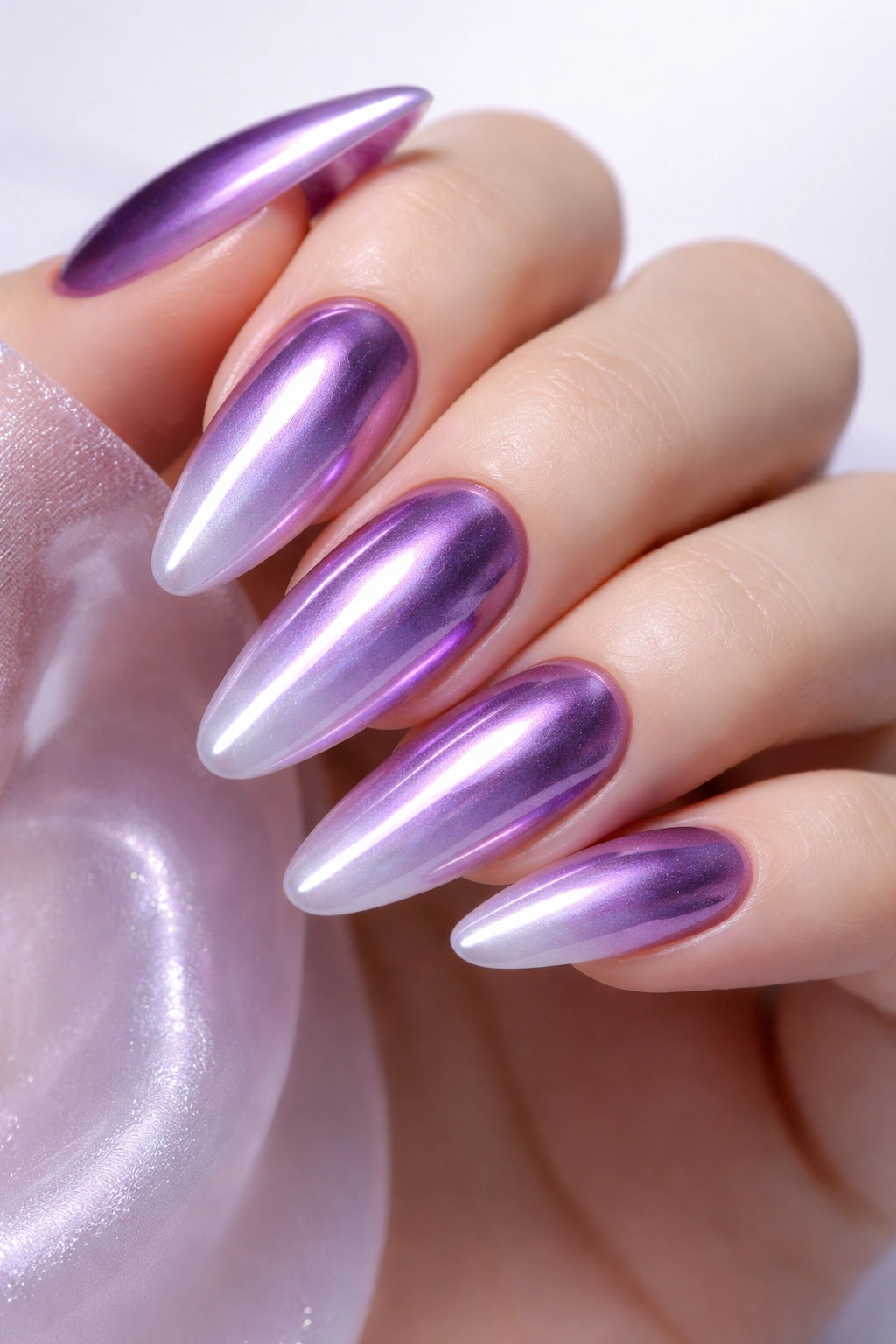Lilac chrome ombré nails showing gradient from deep purple to pale lilac