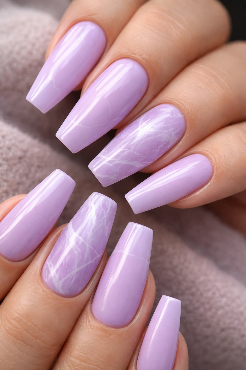 Lilac marble nails with white veins and accent nails