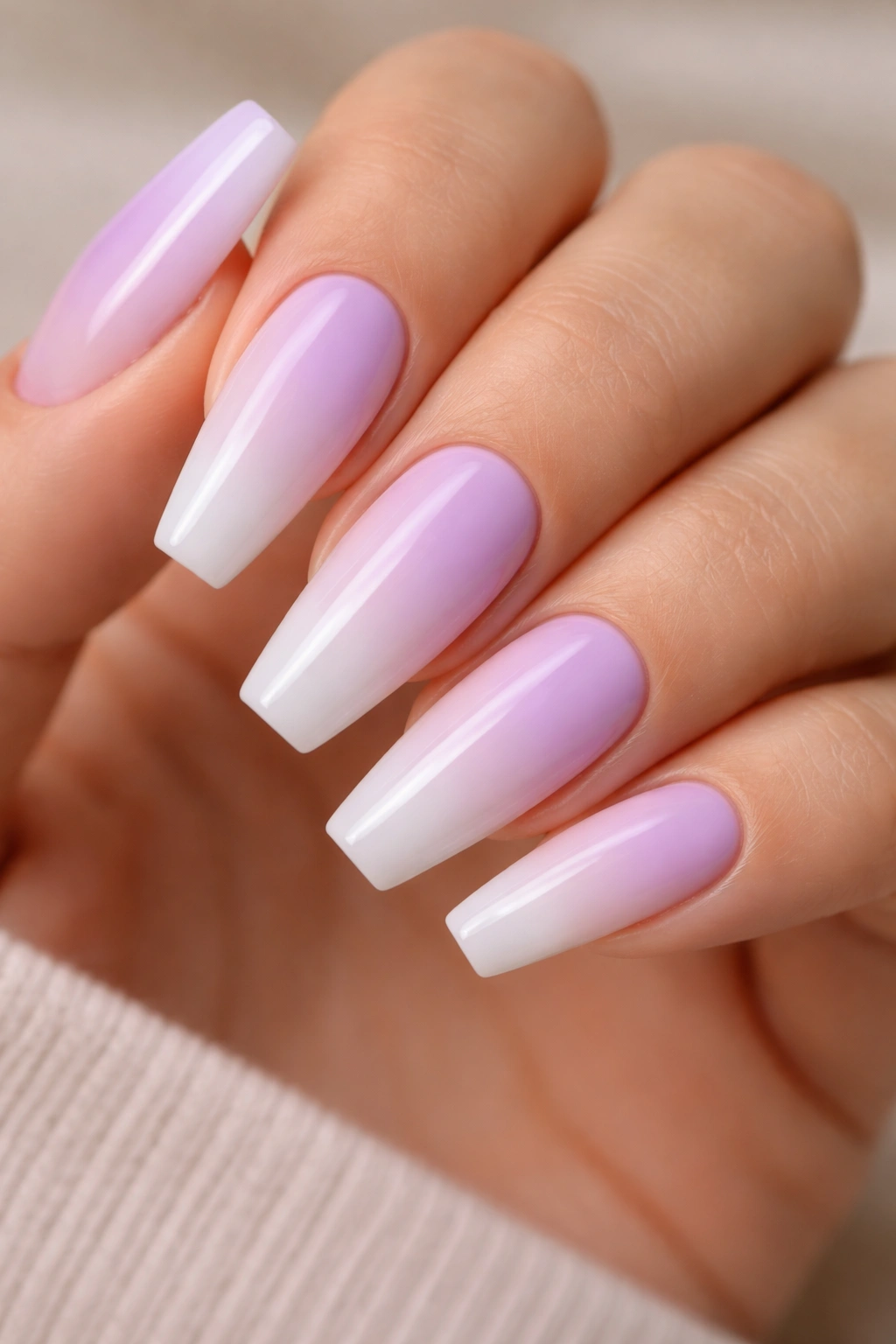 Lilac-to-white ombré on ballerina nails with soft fade
