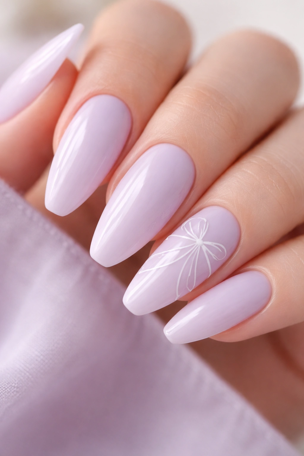 Lilac nails with fine white ribbon line art on milky base