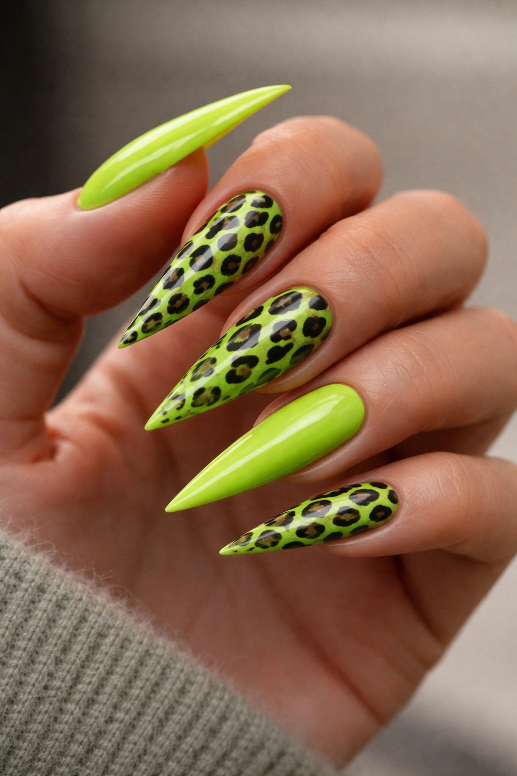 Lime green nails with animal print close-up