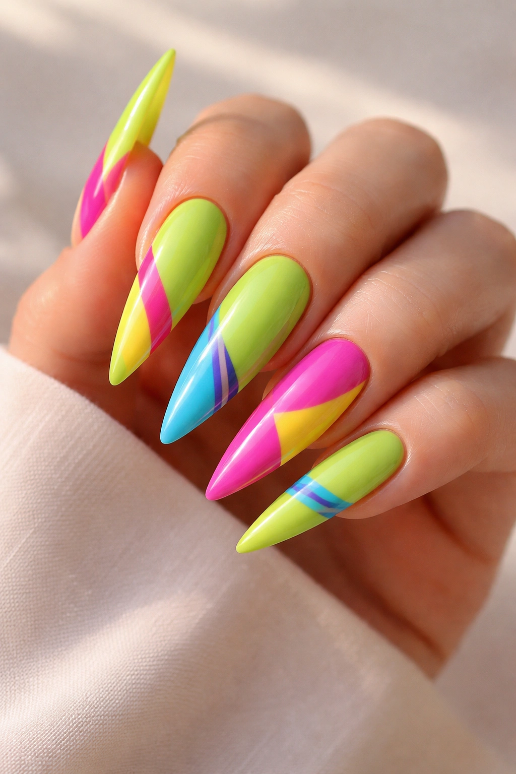 Lime green nails with candy-bright color accents close-up
