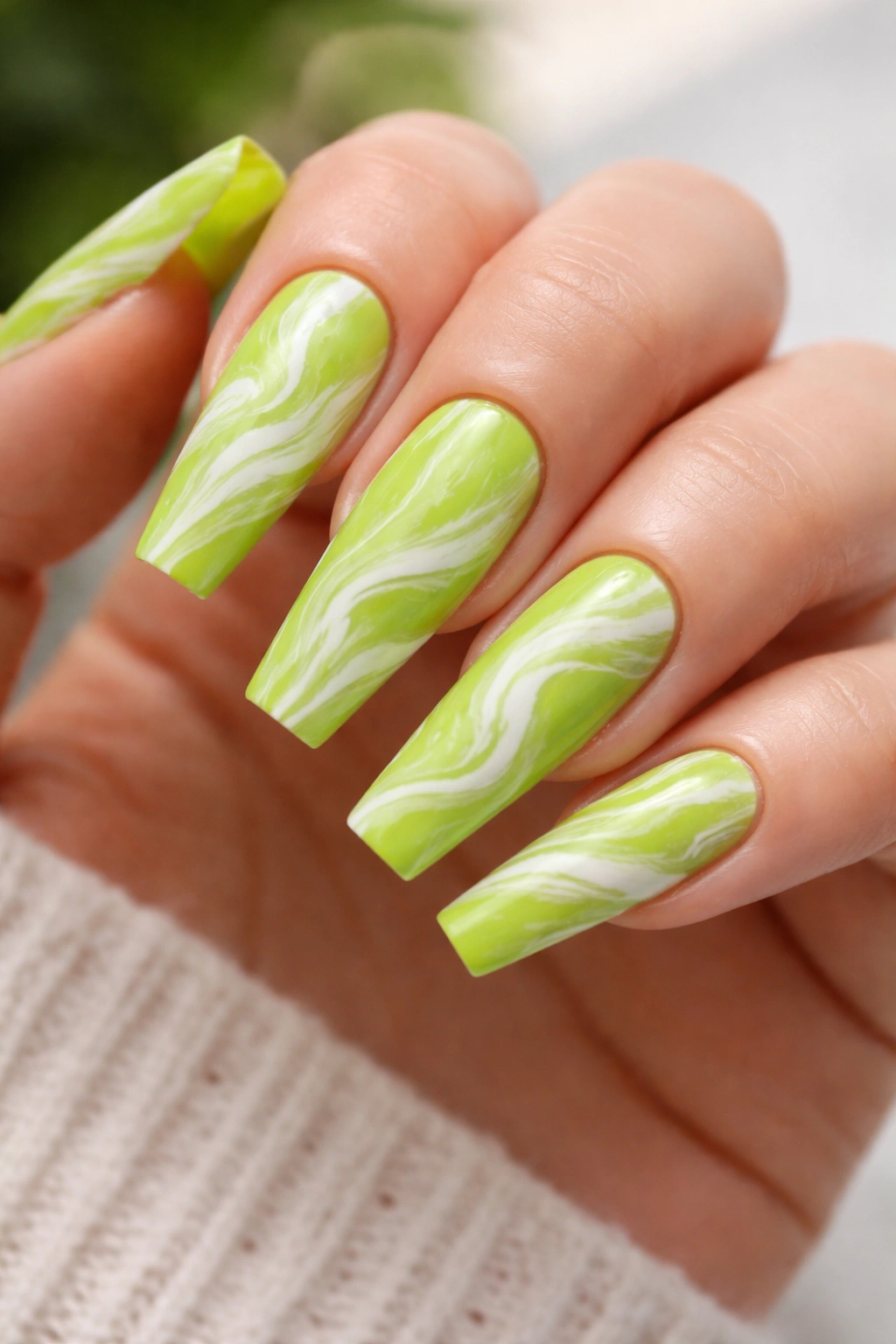 Lime green coffin nails with white marble swirls