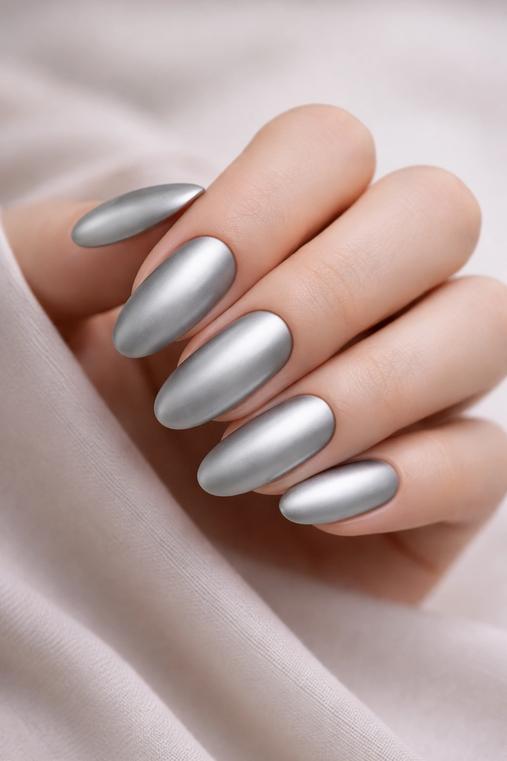 Long oval silver chrome nails with a matte satin finish