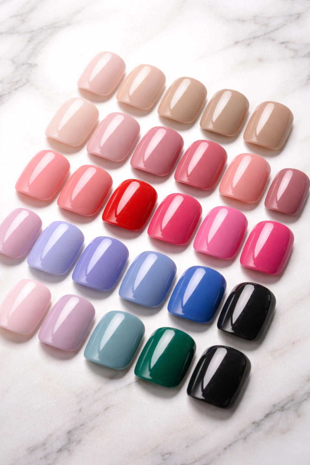 Close-up of Lola Beauty short squoval press-on nails with glossy finish in neutral to bold colors