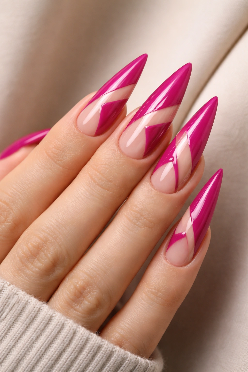 Magenta stiletto nails with negative-space geometric cutouts