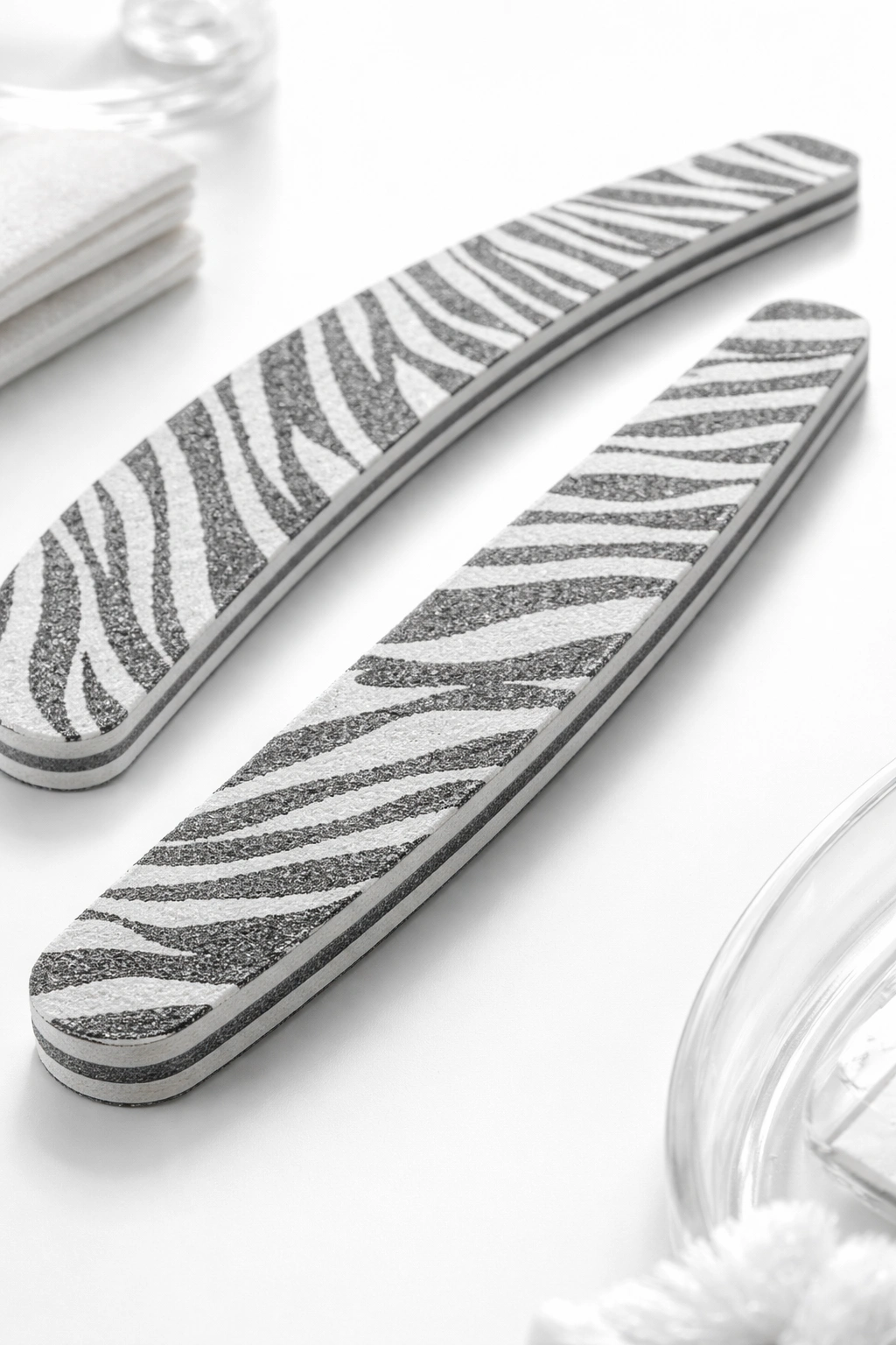 Close-up of a zebra-pattern Makartt nail file on white