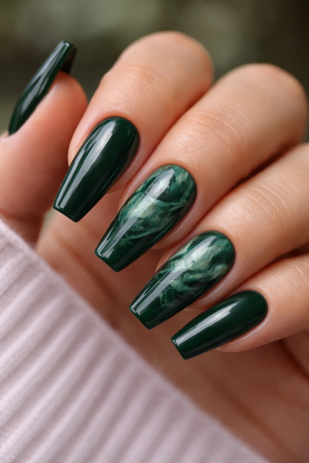 Smoky malachite marble on two accent nails with solid green on others.