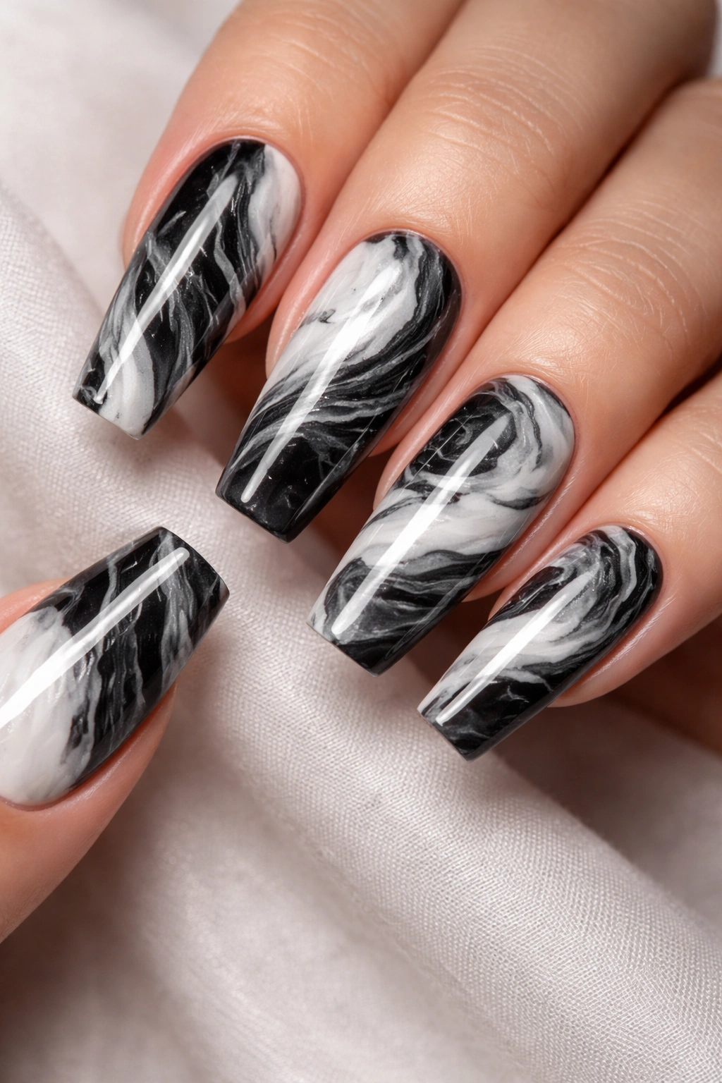 Coffin nails with black and white marble pattern close-up