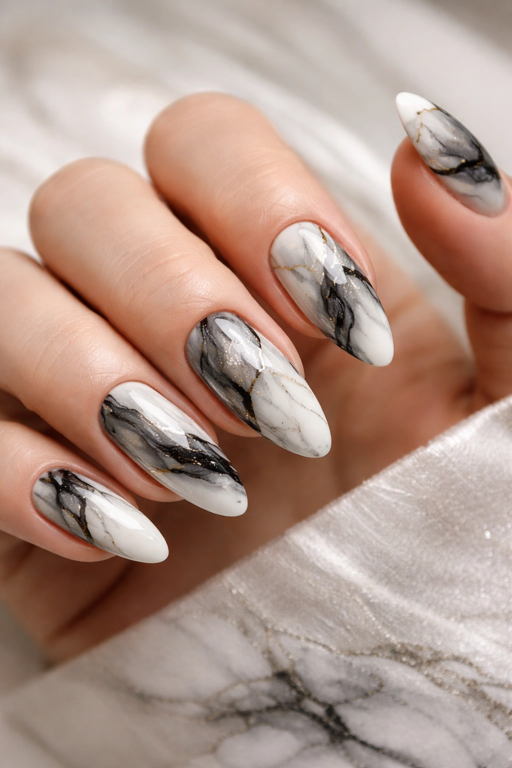 Close-up of black and white marble nails with veining