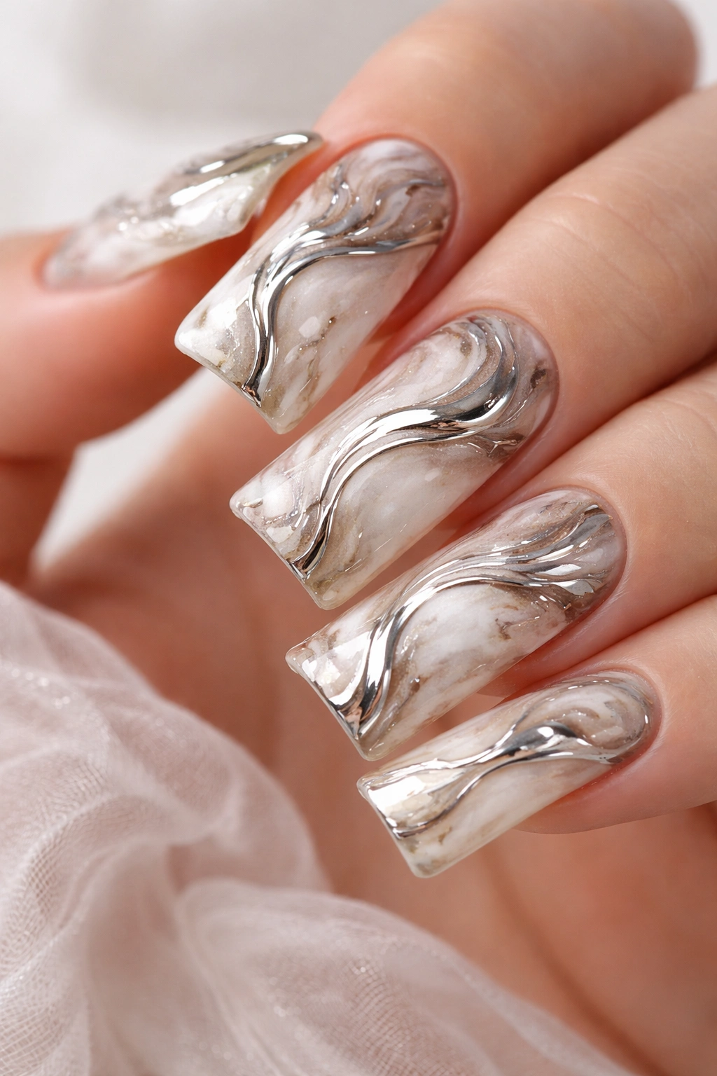Duck nails with marble swirl and chrome accents