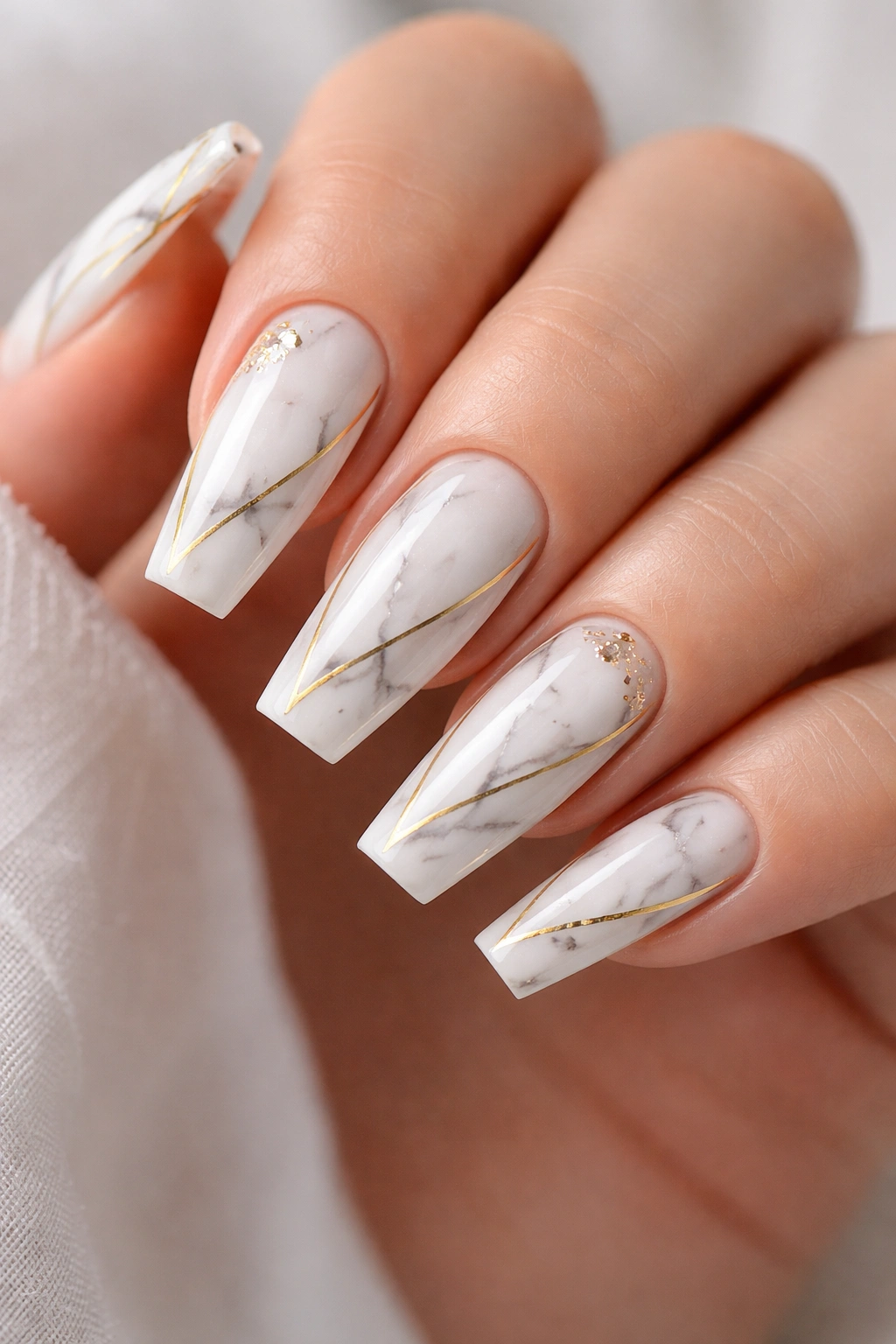 Close-up of marble coffin nails with gold accents