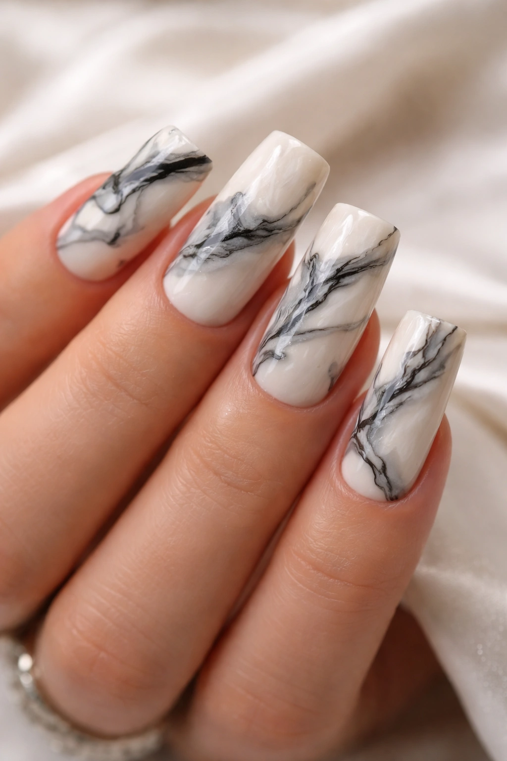 Duck nails with marble pattern on creamy base