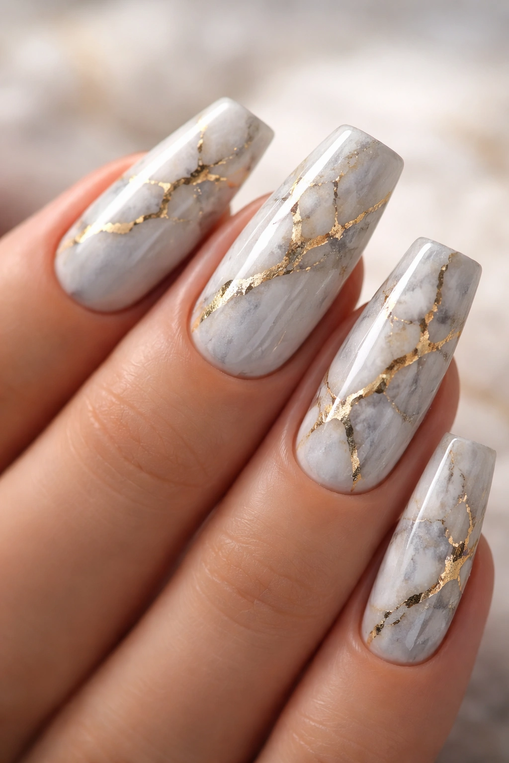 Close-up of marble veined coffin nails with gold lines