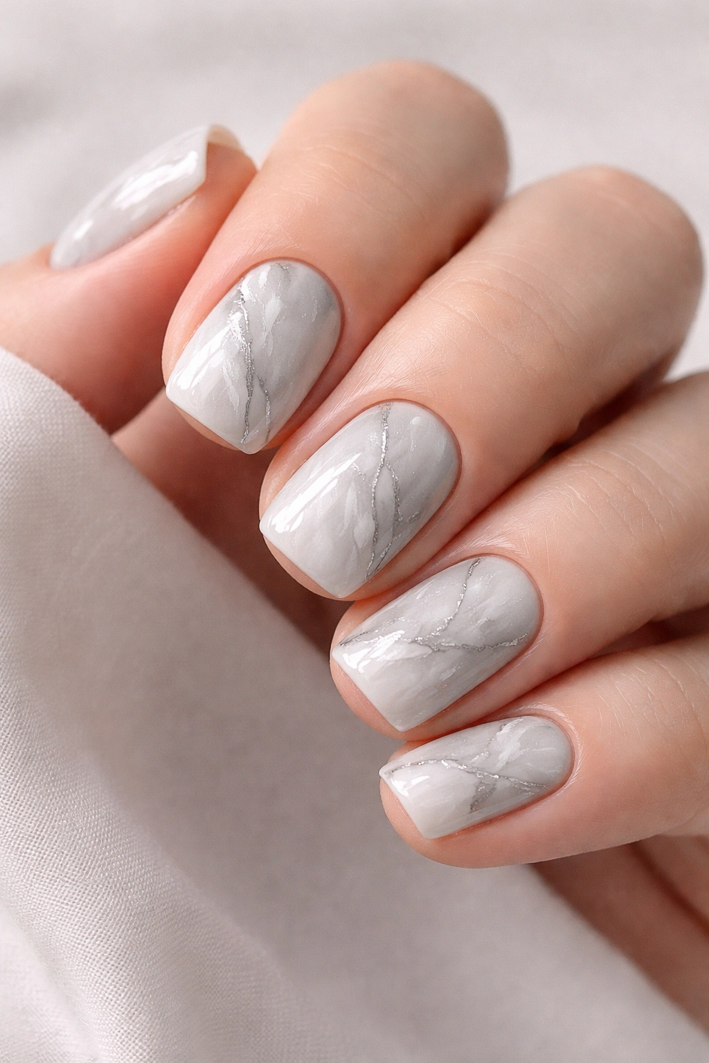 Close-up of marble grey and white nails