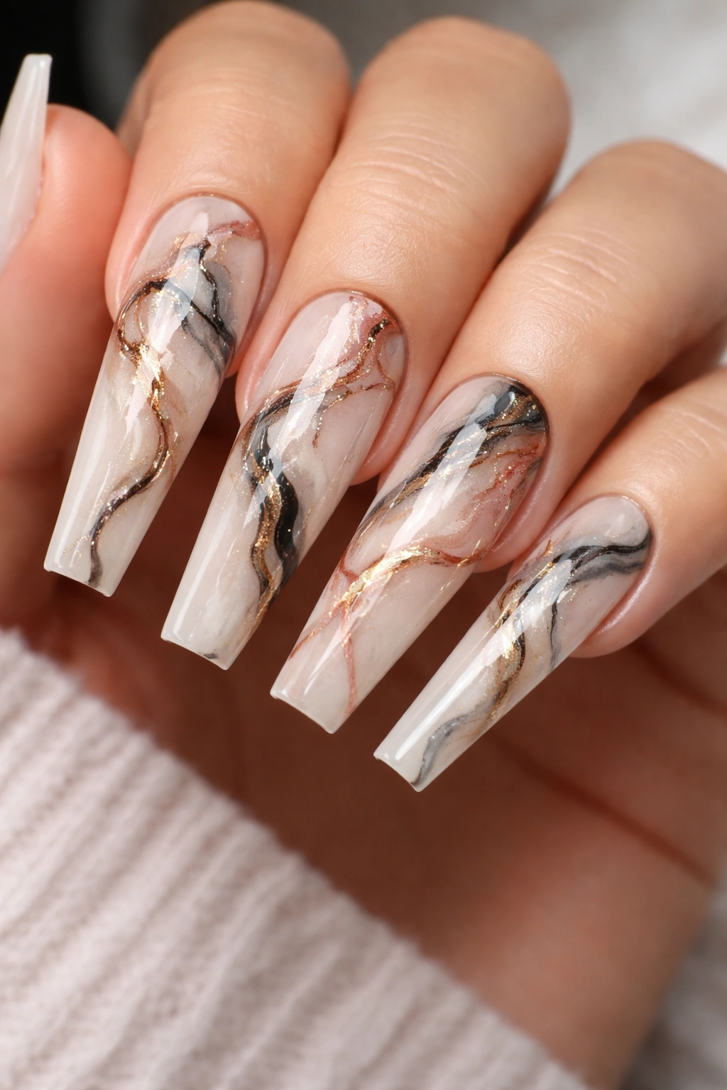 Close-up of coffin nails with marble veining in contrasting colors