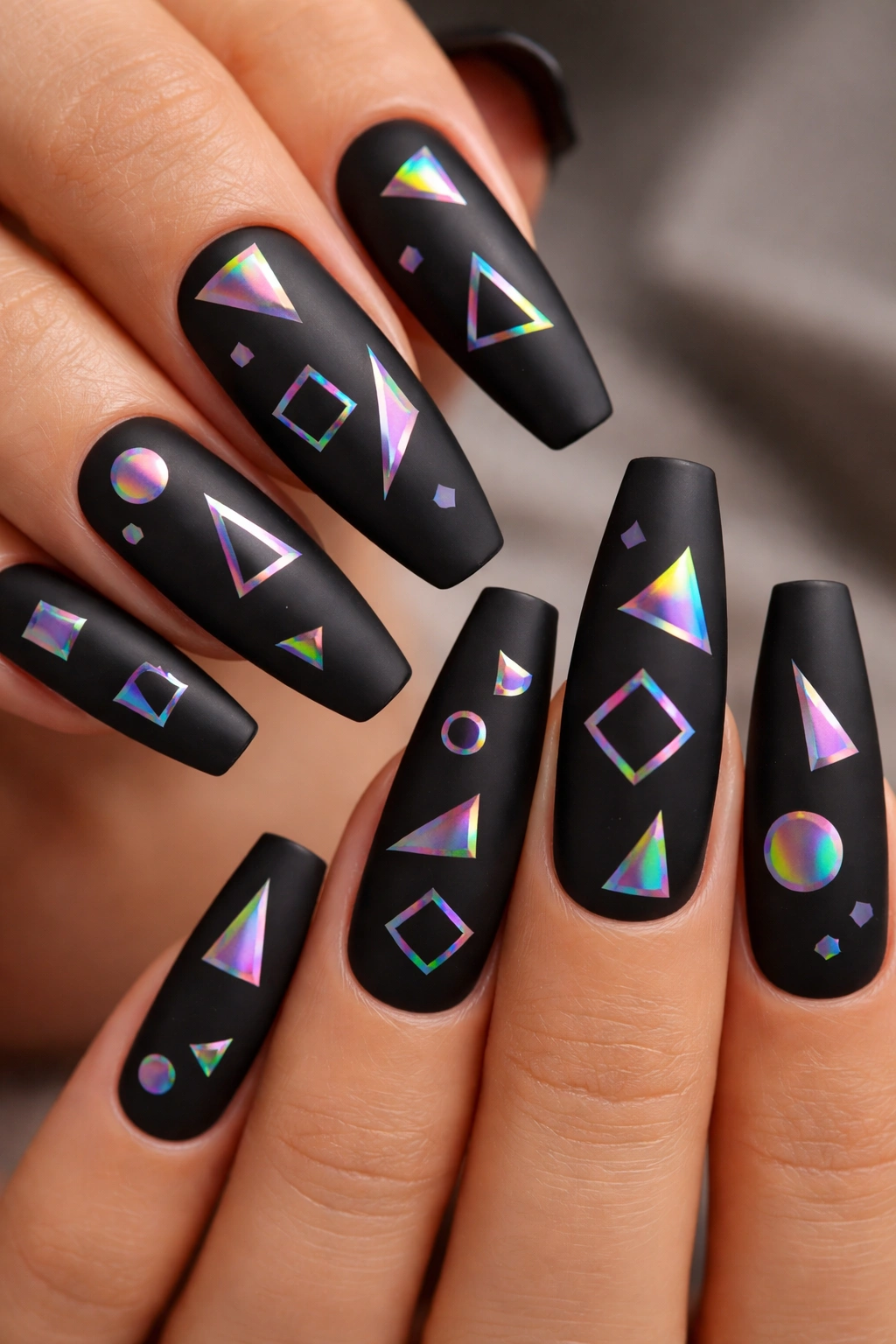 Matte black coffin nails with holographic geometric shapes