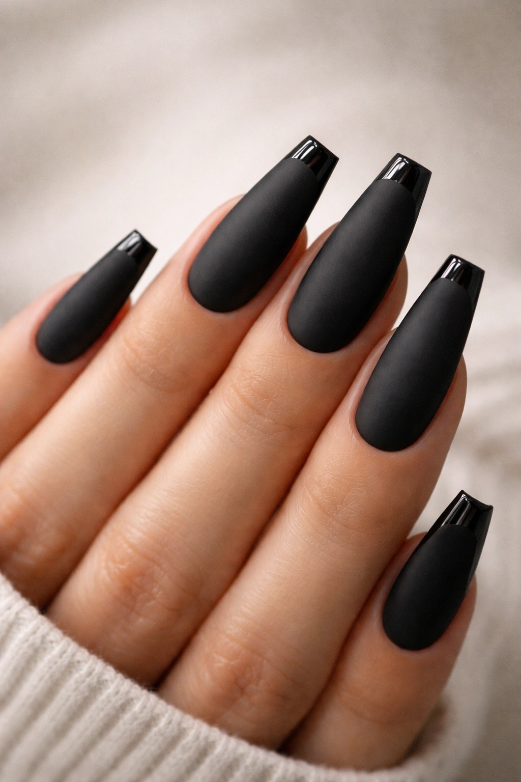 Matte black nails with razor-thin glossy tip on ballerina shape
