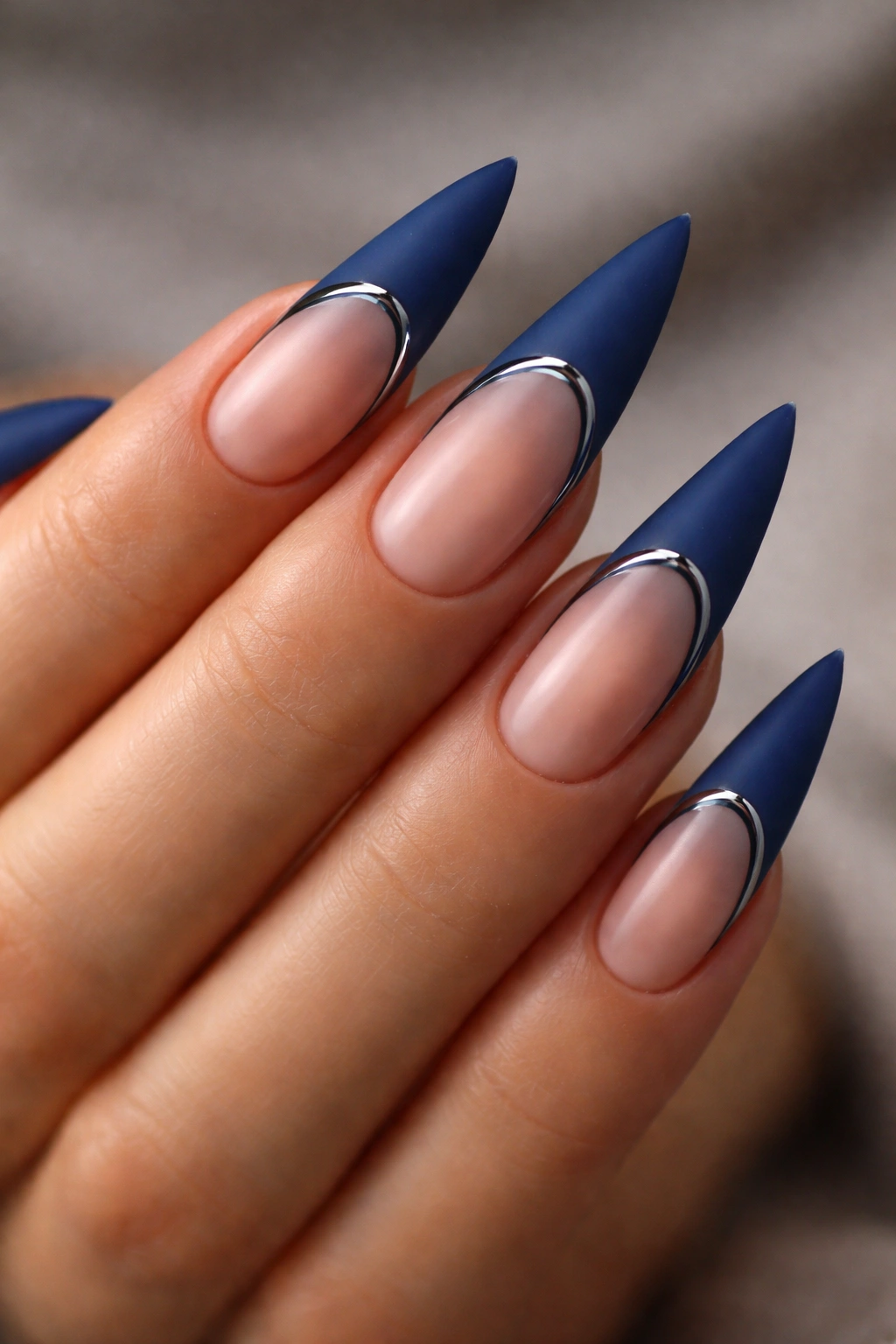 Close-up of matte blue French tips with a thin glossy accent line