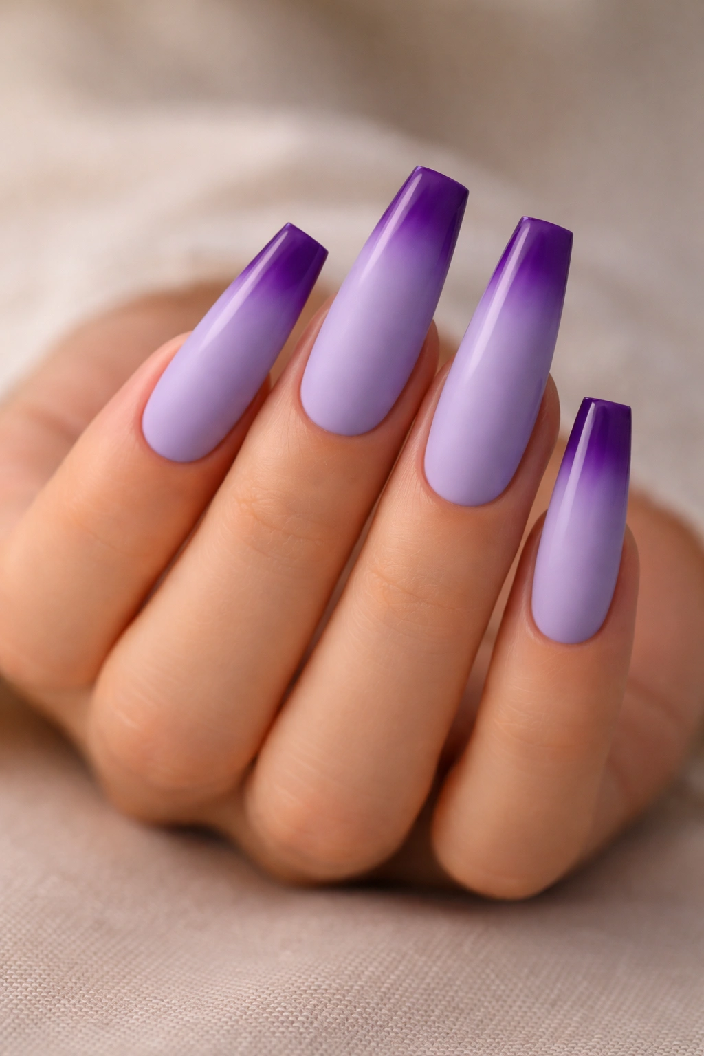 Matte lavender nails with glossy purple tip ombre on coffin nails