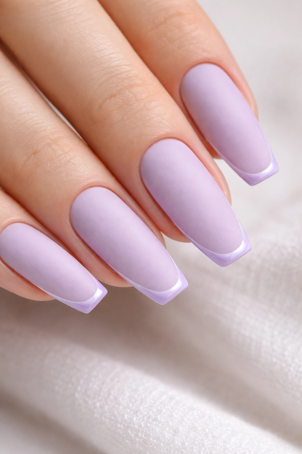 Matte lilac nails with glossy micro-French edge on ballerina shape