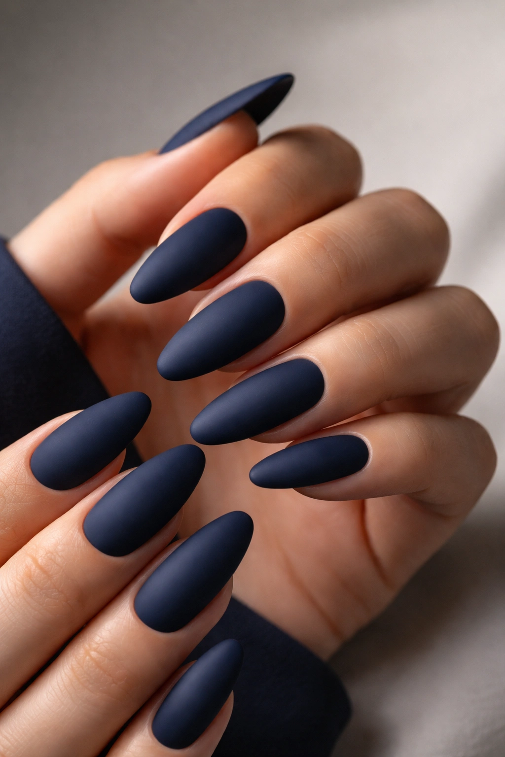 Close-up of deep matte navy nails