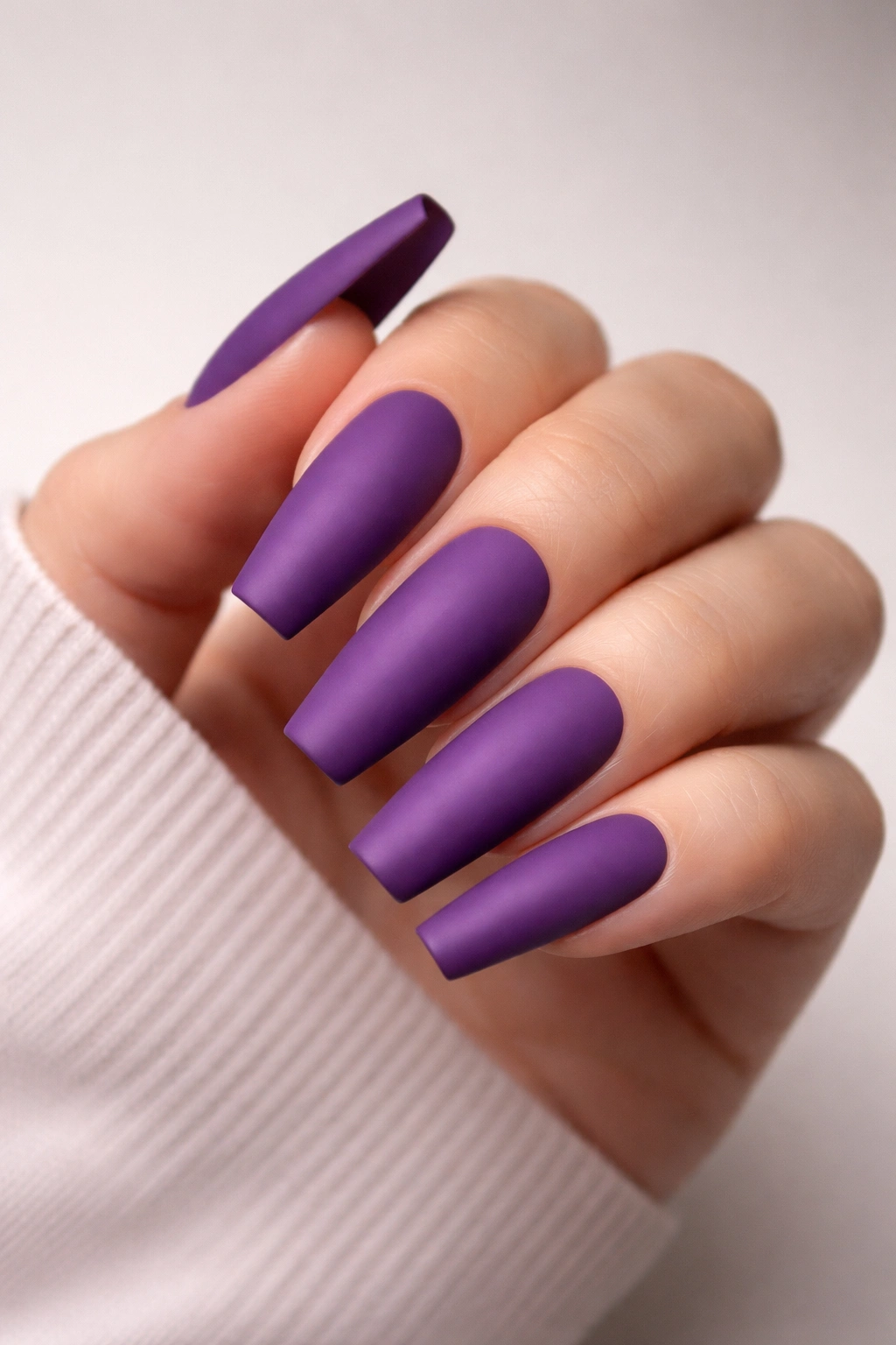 Matte purple coffin nails close-up