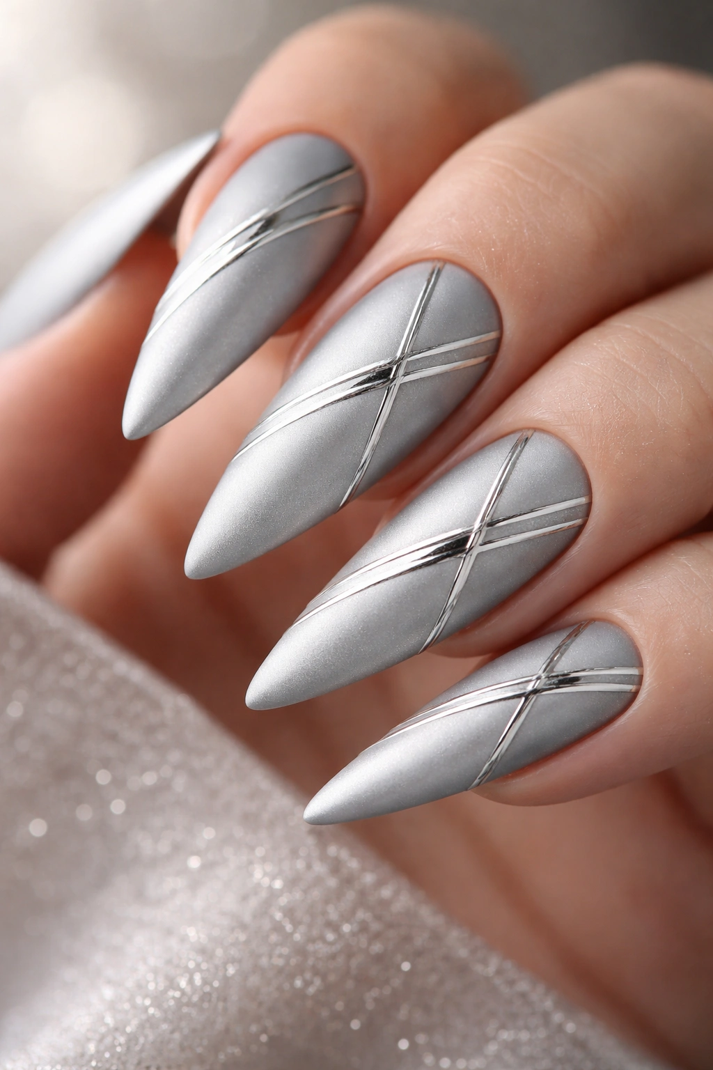 Matte silver nails with metallic accent lines
