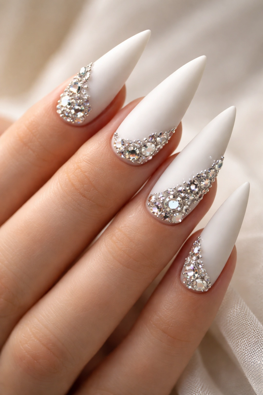 Matte white nails with 3D rhinestone clusters