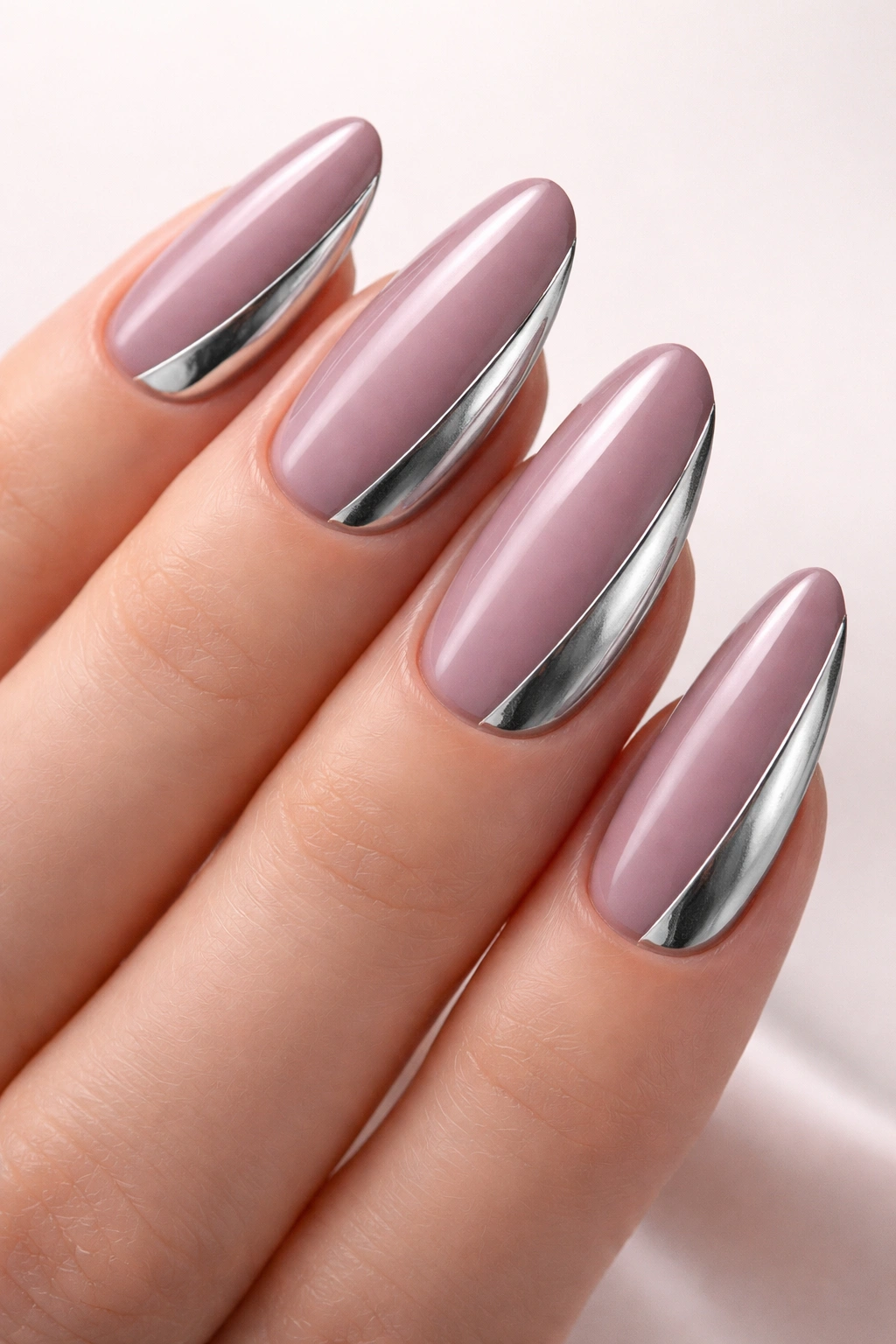 Mauve nails with silver geometric side design.
